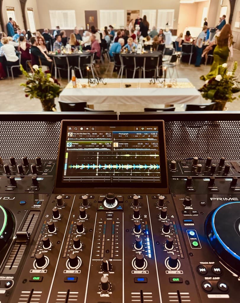 DJ controller at a wedding reception near the head table